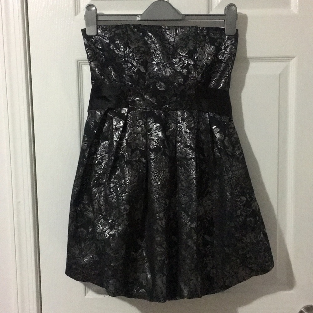 Black and silver dress with silk black ties.